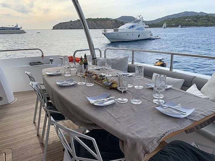 a table set for a dinner on a boat aboard LI-JOR Yacht for Sale