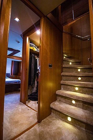 a wooden staircase in a room aboard LI-JOR Yacht for Sale