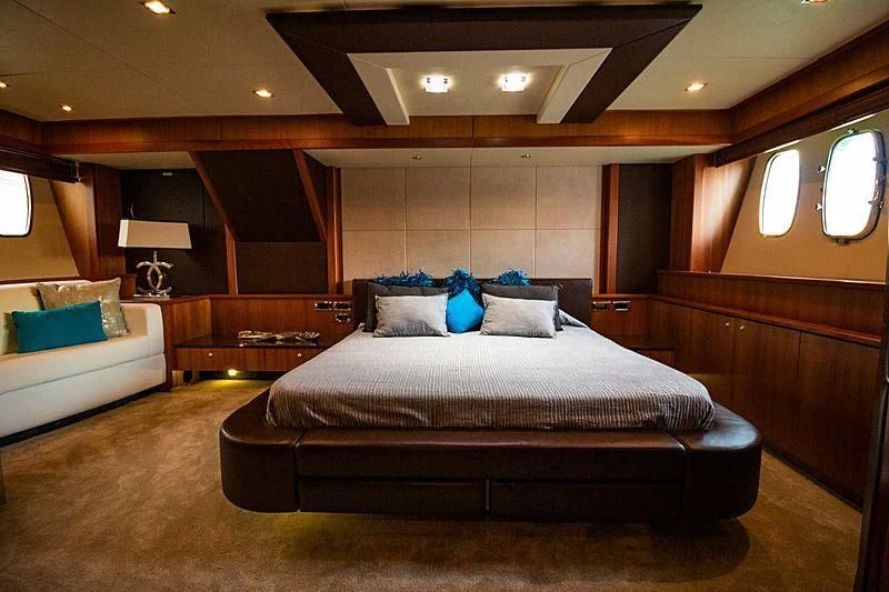 a large bed in a room aboard LI-JOR Yacht for Sale