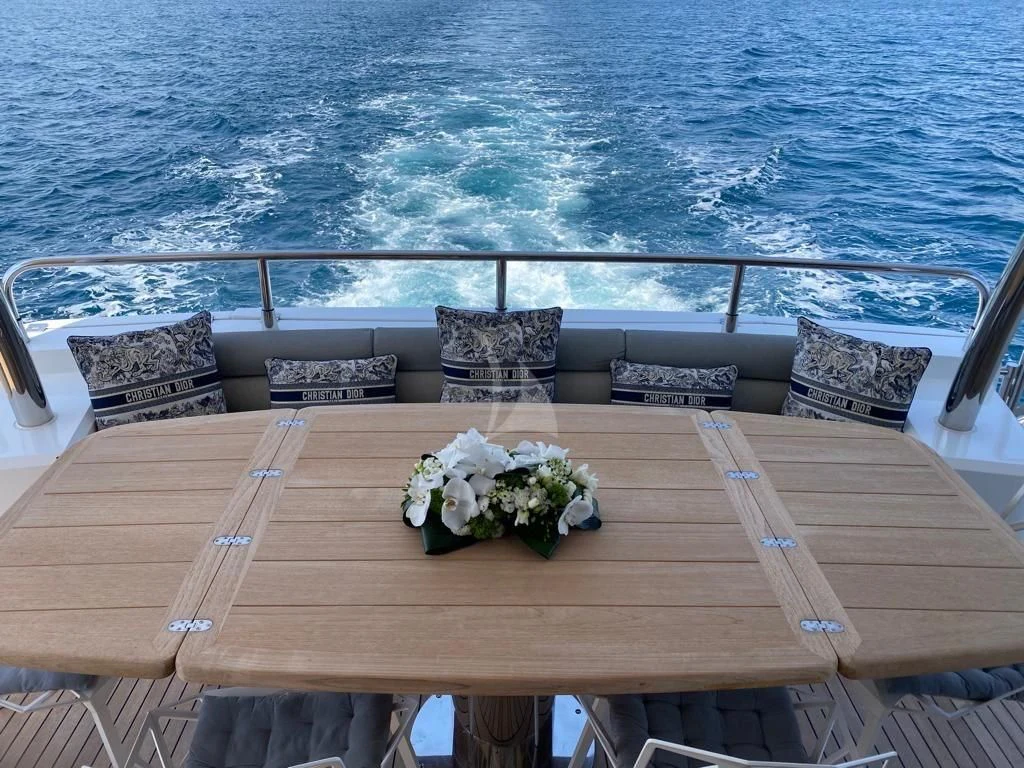 a table with flowers on it aboard LI-JOR Yacht for Sale