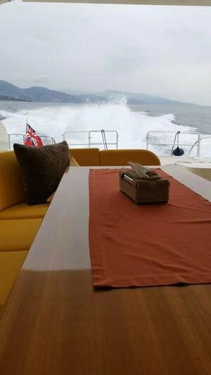 a bed with a pillow on it aboard DG Yacht for Sale