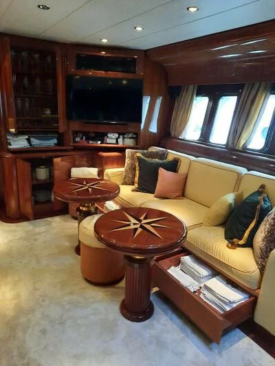 a living room with a couch and coffee table aboard DG Yacht for Sale