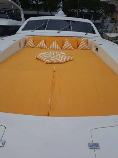 a yellow umbrella on a boat aboard DG Yacht for Sale