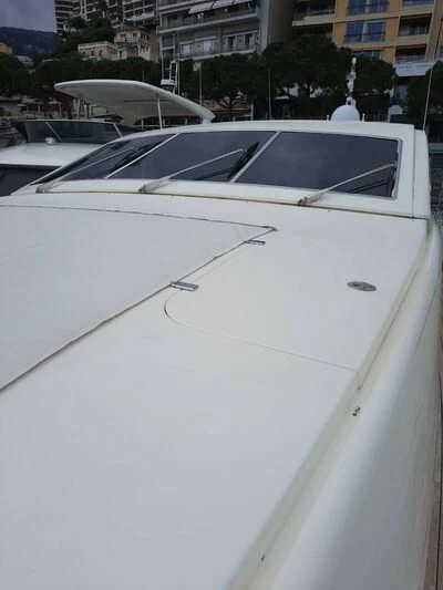 a white car with a black hood aboard DG Yacht for Sale