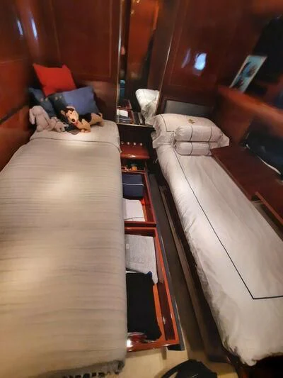 a person lying on a bed aboard DG Yacht for Sale