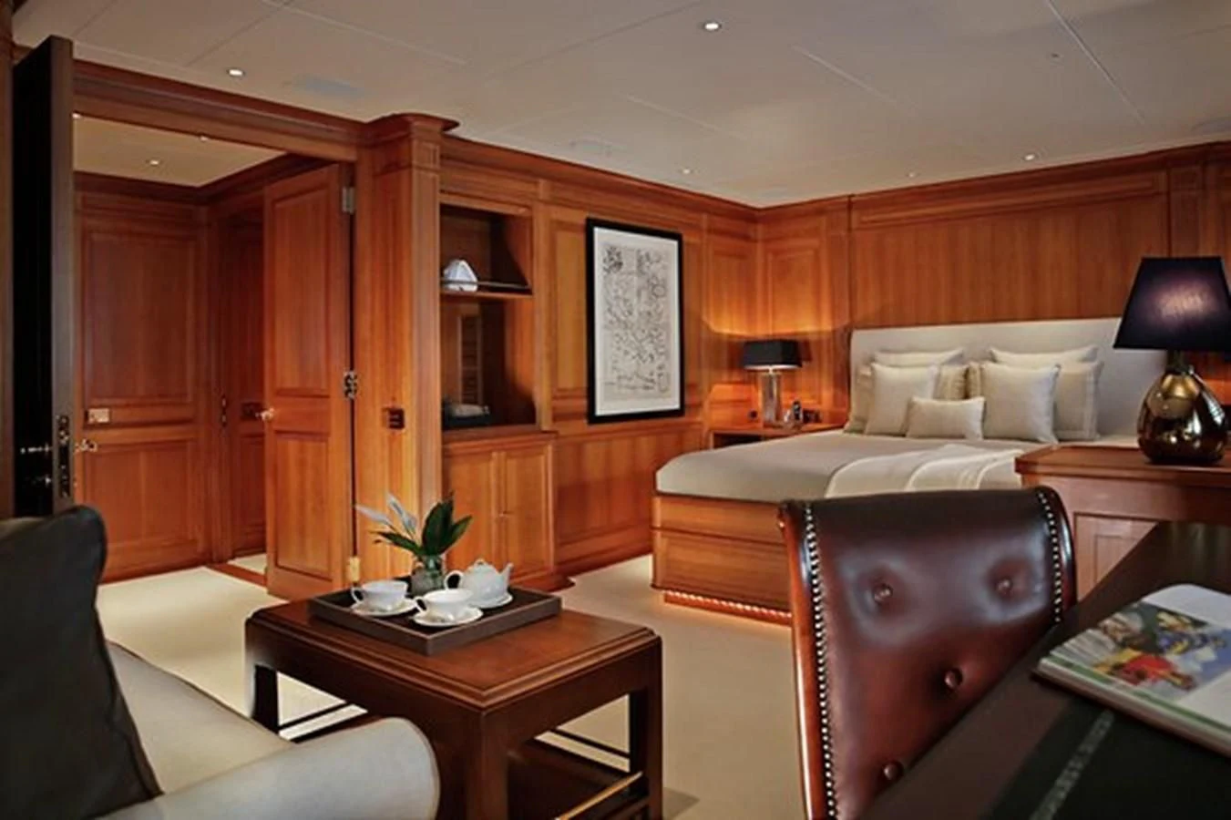 a room with a bed and a table aboard LA LUNA Yacht for Sale
