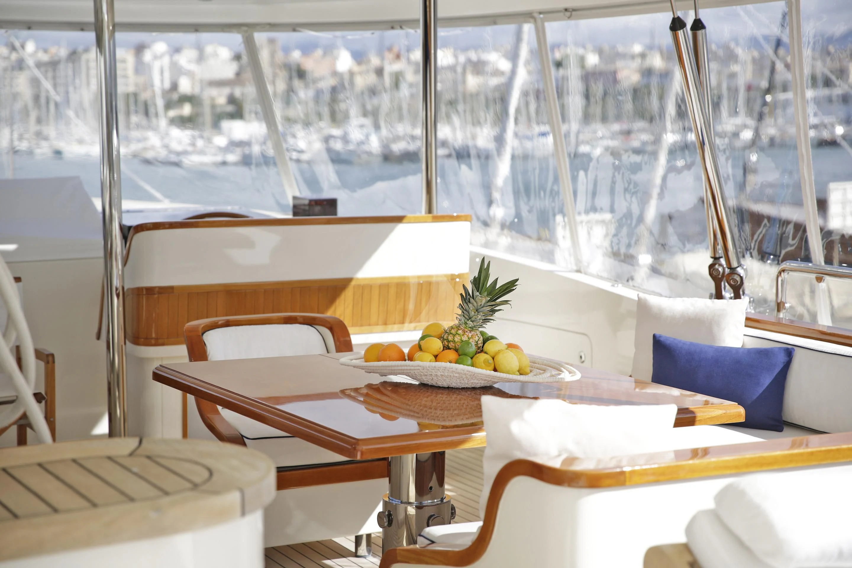 a table with chairs and a plant on it aboard LA LUNA Yacht for Sale