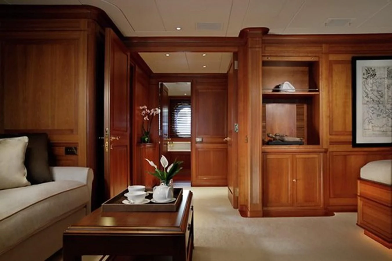 a room with a table and couch aboard LA LUNA Yacht for Sale