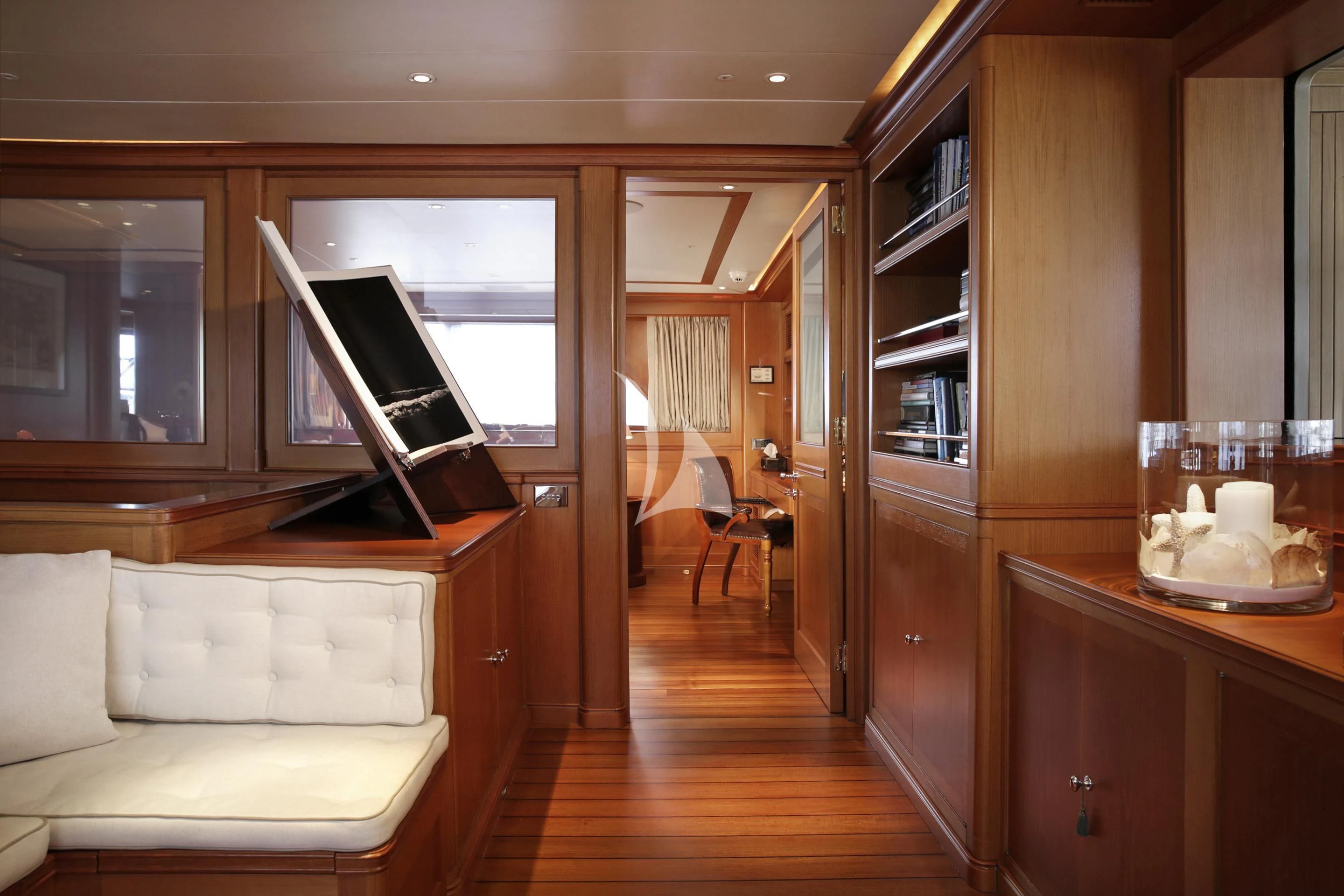 a living room with a wood floor aboard LA LUNA Yacht for Sale