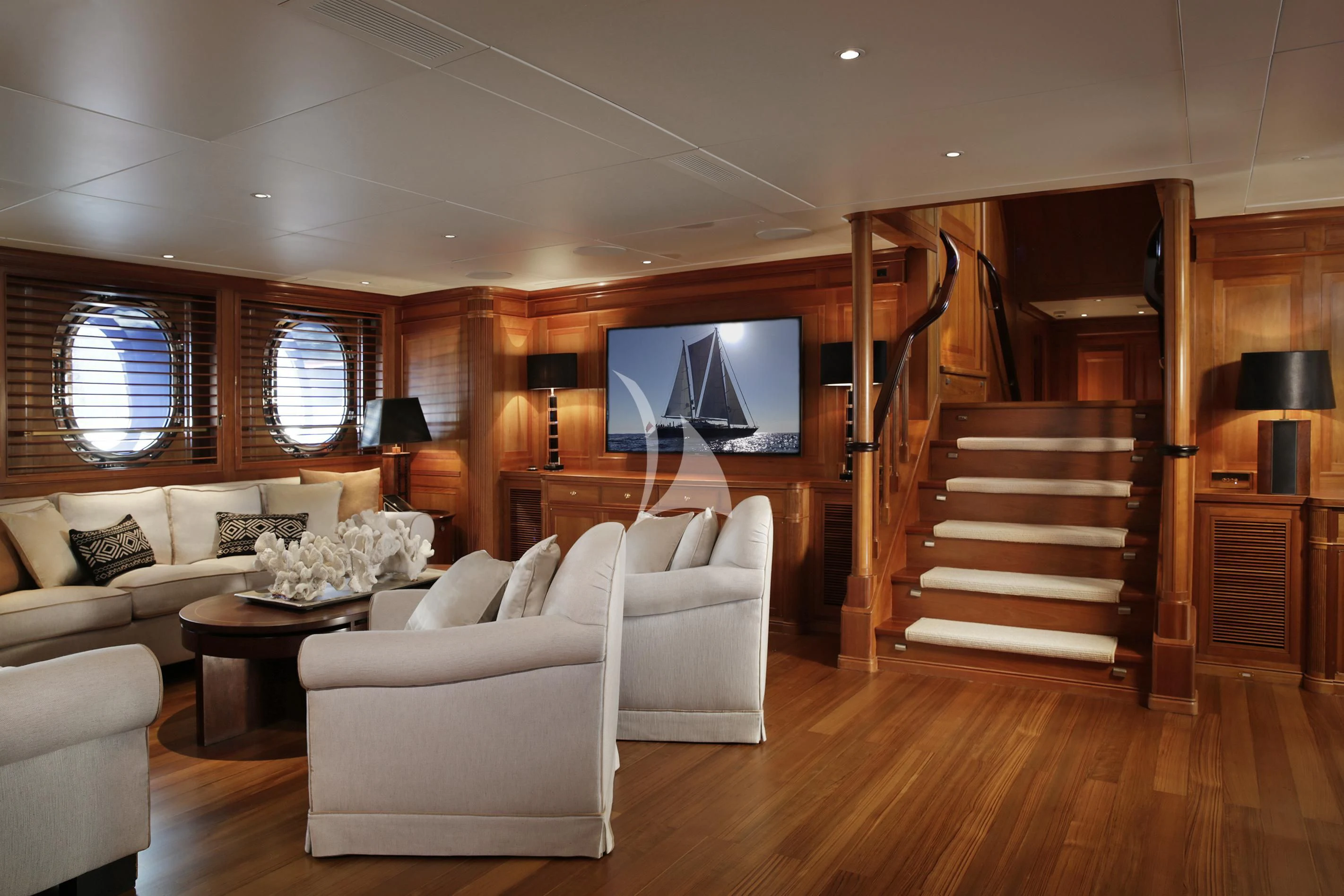 a living room with a staircase and a staircase aboard LA LUNA Yacht for Sale