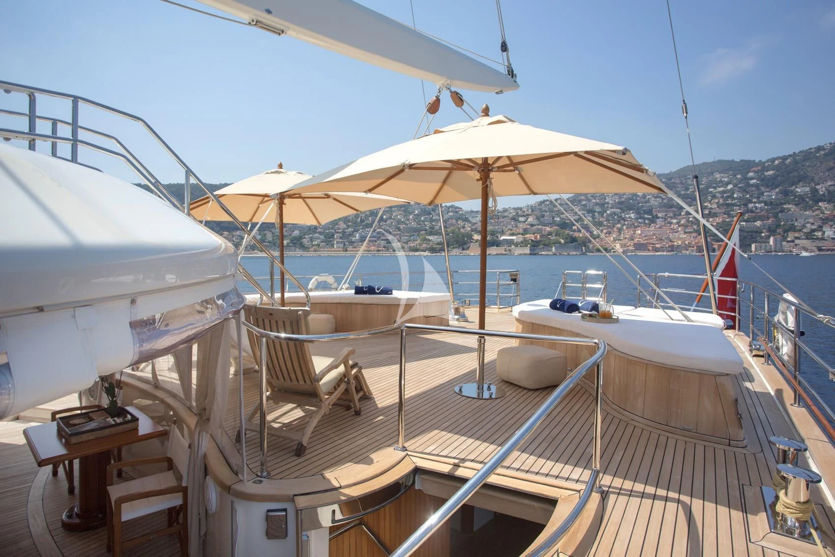 a deck with umbrellas and chairs on it aboard LA LUNA Yacht for Sale