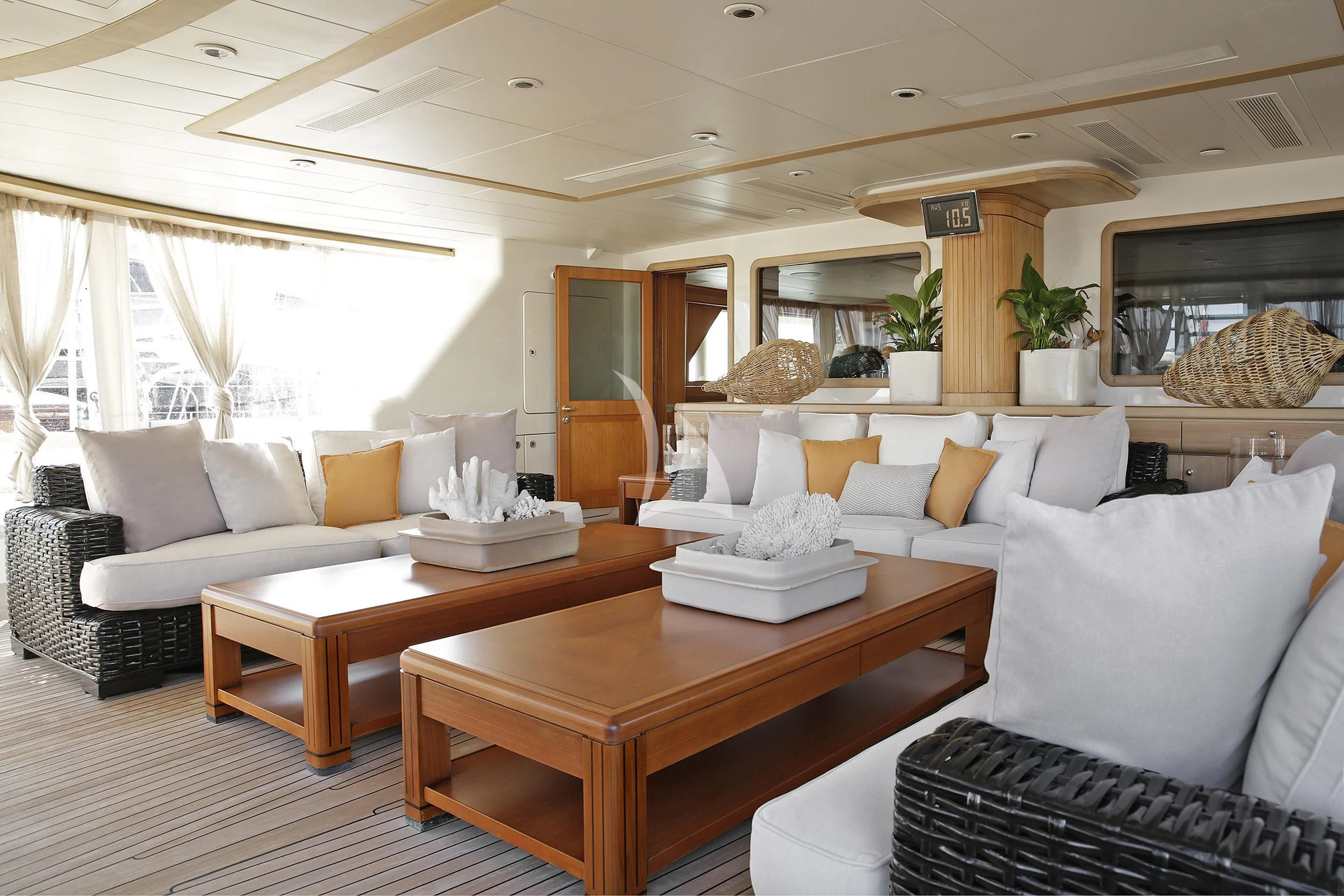 a living room with a table and couches aboard LA LUNA Yacht for Sale