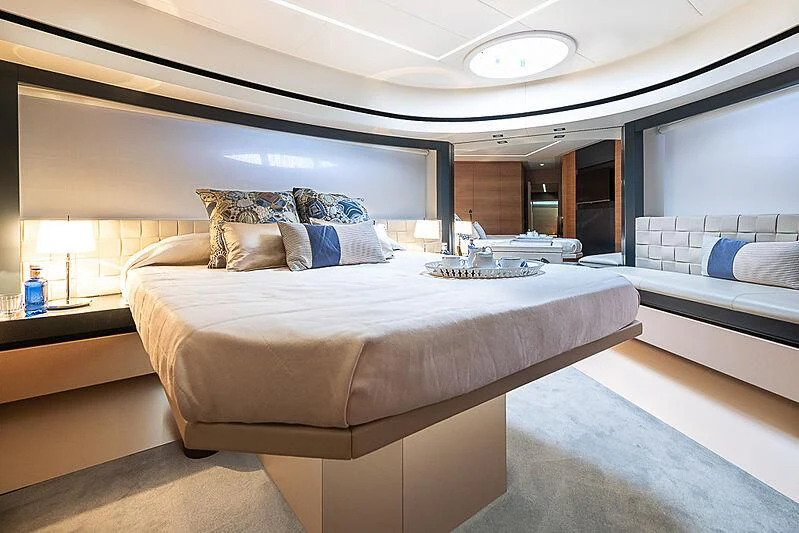 a room with a bed and a mirror aboard KIKI V Yacht for Sale