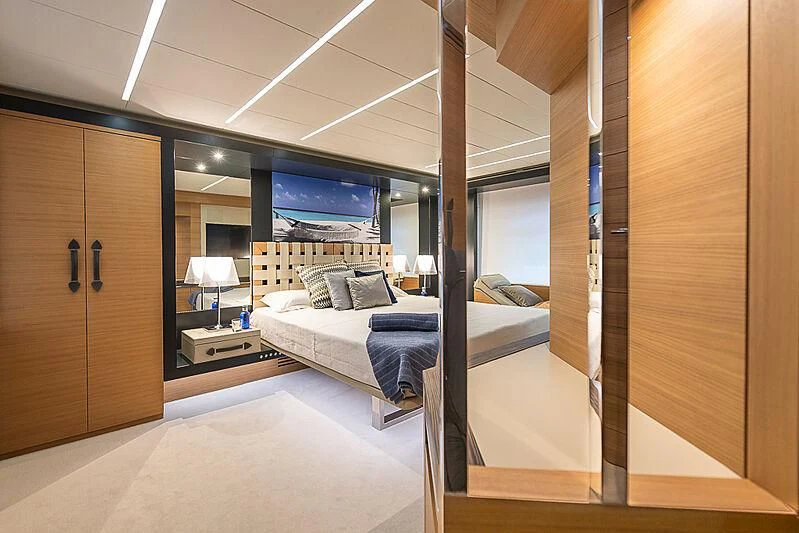a room with a bed and a desk aboard KIKI V Yacht for Sale