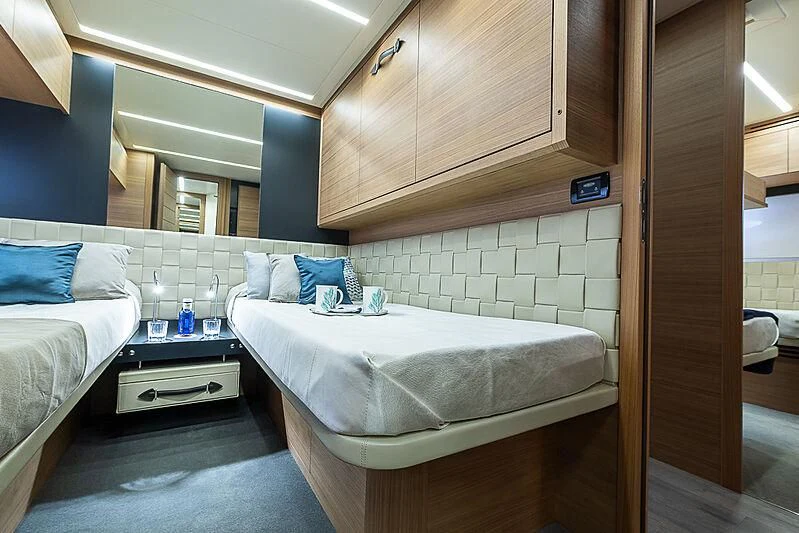 a room with a bed and a sink aboard KIKI V Yacht for Sale