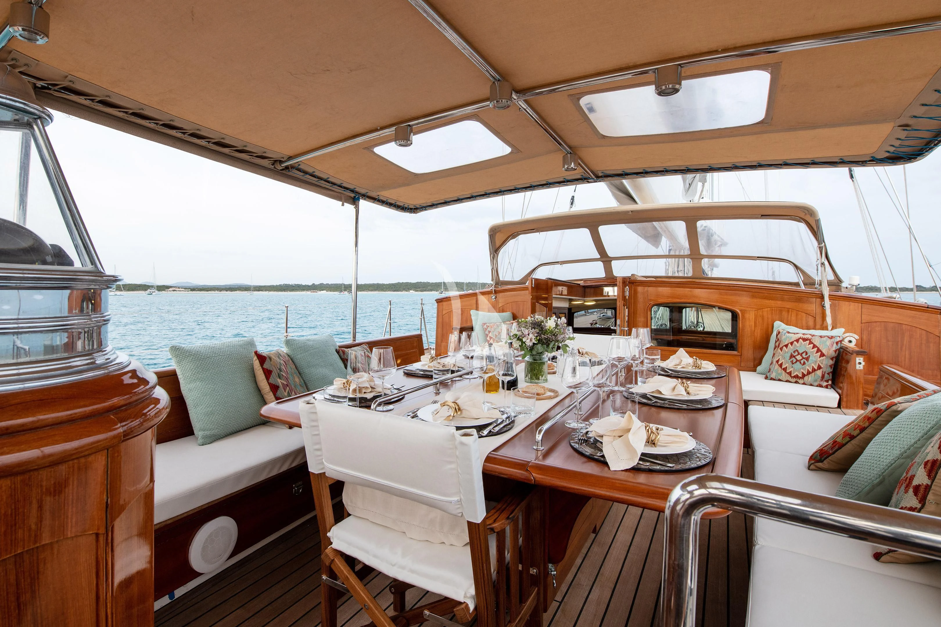 a boat with a table set for a meal aboard WINDROSE OF AMSTERDAM Yacht for Sale