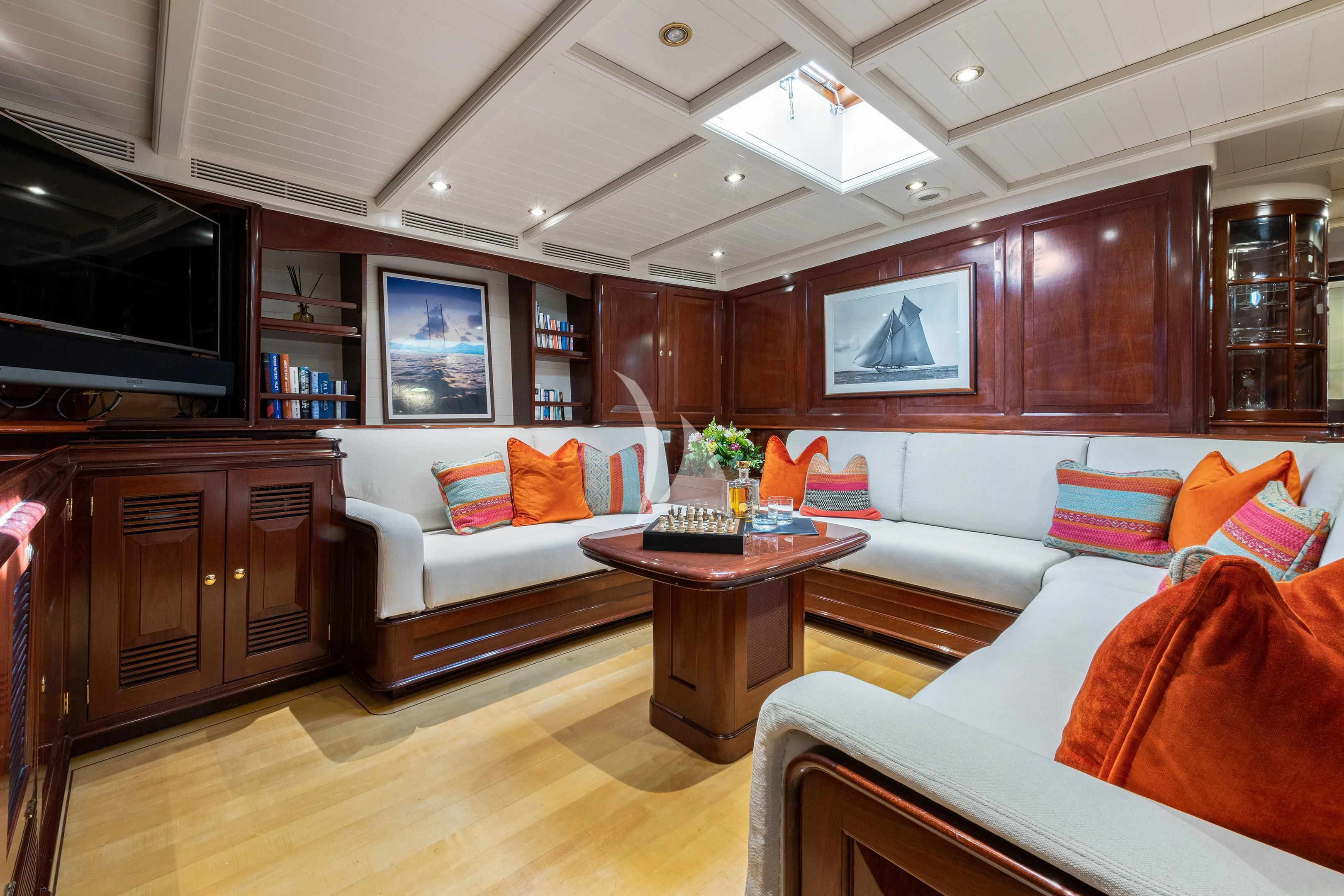 a living room with a couch and a coffee table aboard WINDROSE OF AMSTERDAM Yacht for Sale
