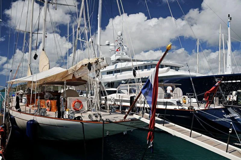 a couple of boats are parked in a harbor aboard WINDROSE OF AMSTERDAM Yacht for Sale