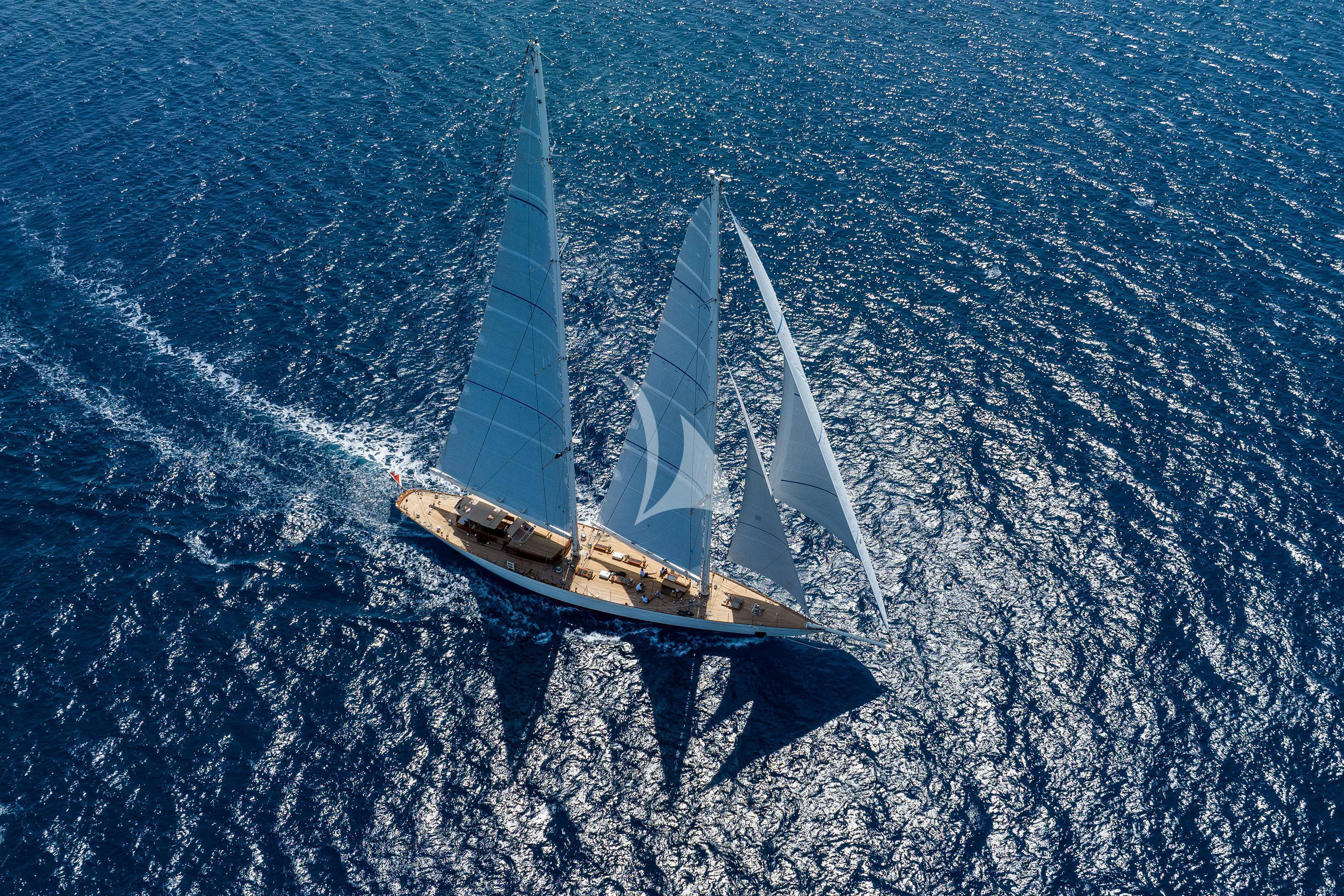 a helicopter flying over a body of water aboard WINDROSE OF AMSTERDAM Yacht for Sale