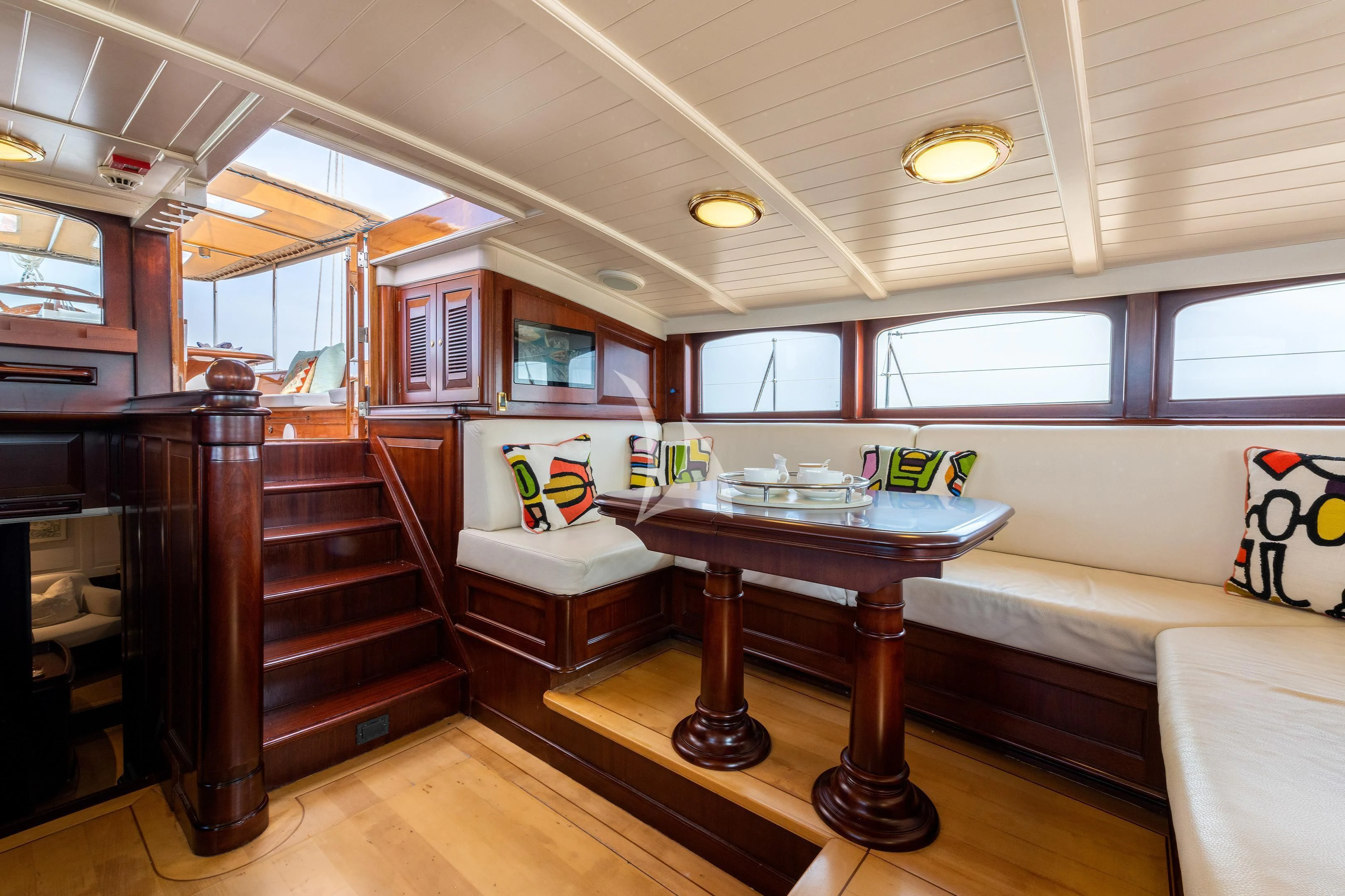 a room with a couch and a table aboard WINDROSE OF AMSTERDAM Yacht for Sale
