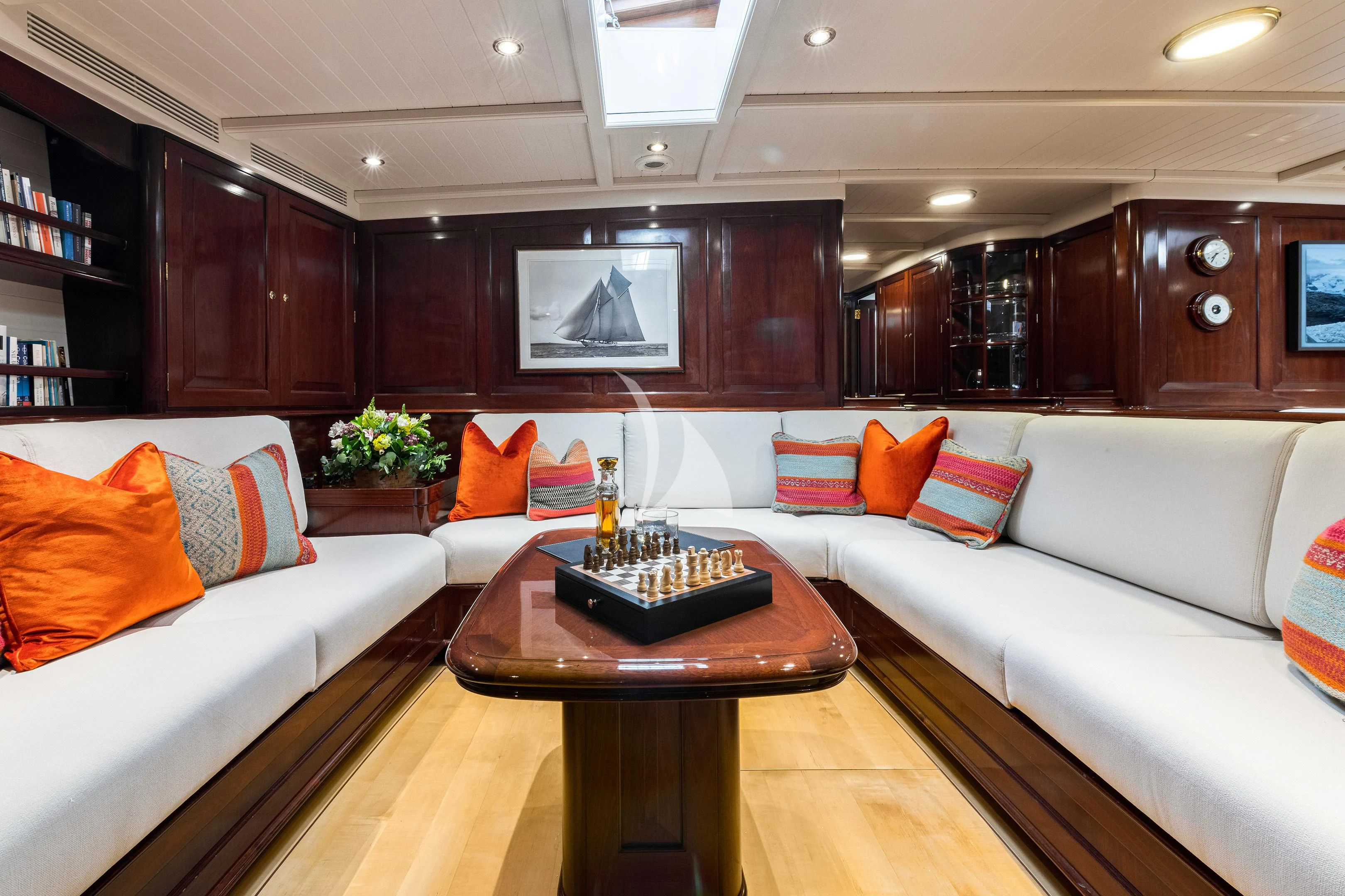 a living room with a couch and a coffee table aboard WINDROSE OF AMSTERDAM Yacht for Sale
