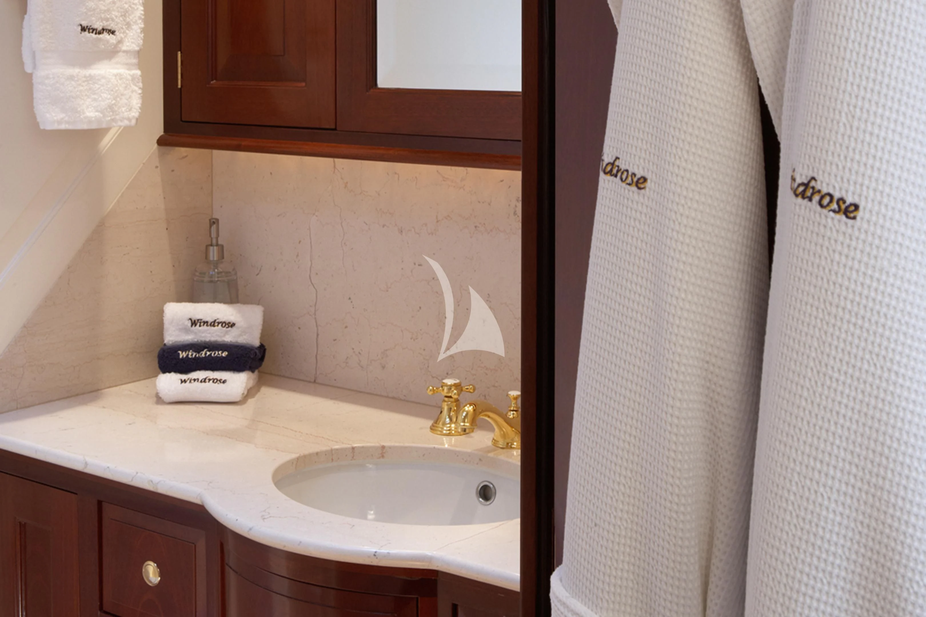 a bathroom with a sink and a shower curtain aboard WINDROSE OF AMSTERDAM Yacht for Sale