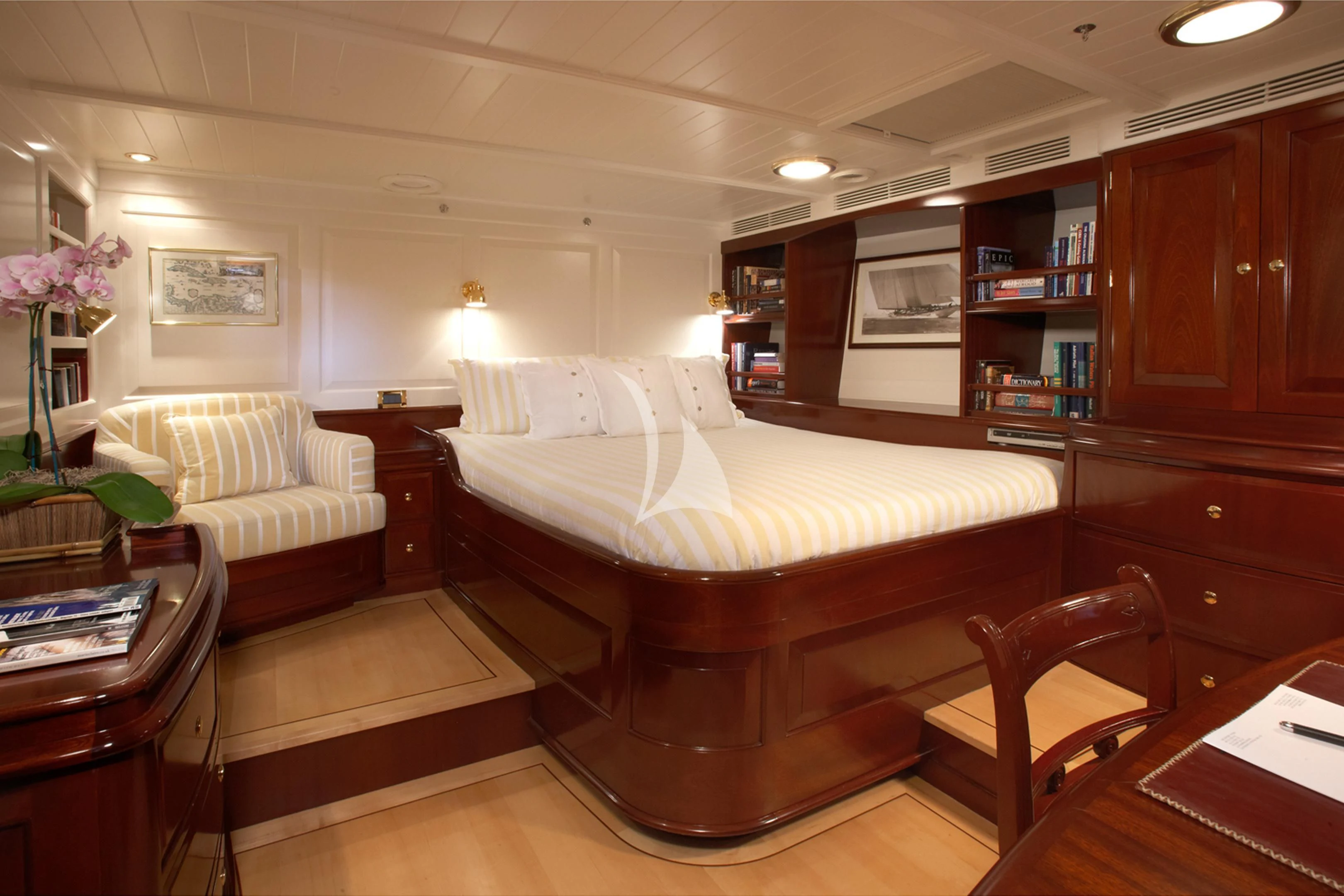 a bedroom with a bed and a desk aboard WINDROSE OF AMSTERDAM Yacht for Sale
