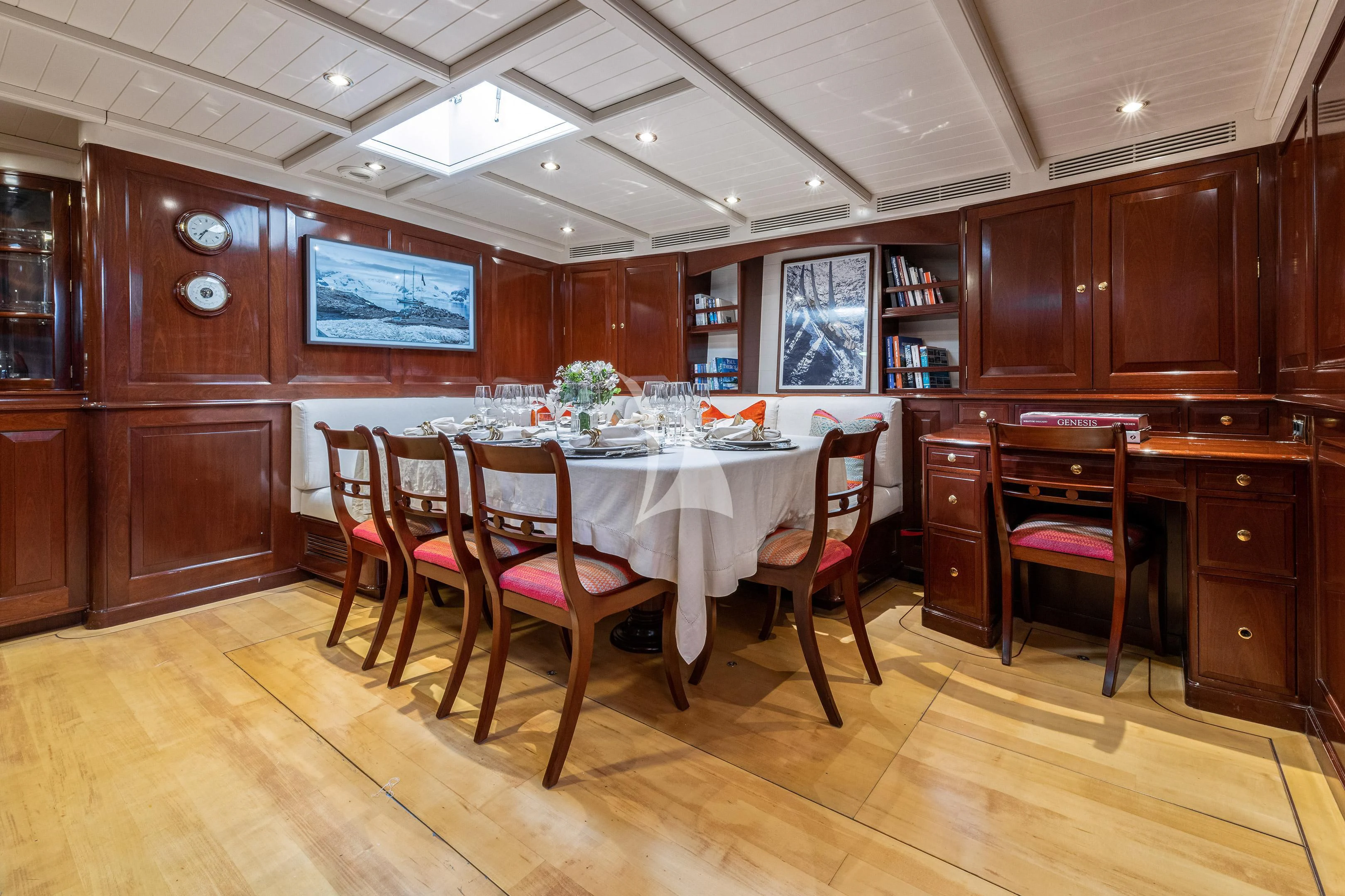 a large wooden kitchen with a table and chairs aboard WINDROSE OF AMSTERDAM Yacht for Sale