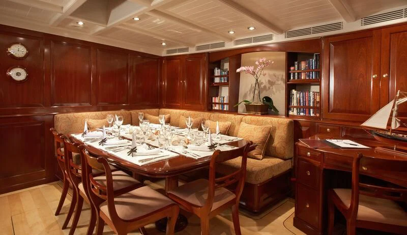 a room with a table and chairs aboard WINDROSE OF AMSTERDAM Yacht for Sale