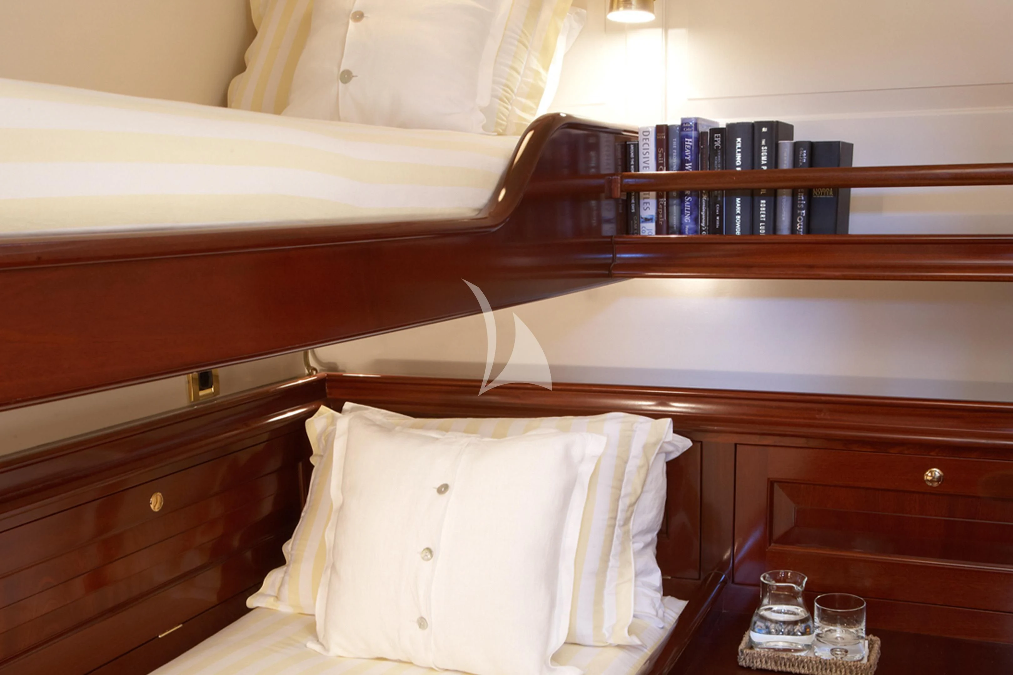 a bed with a white sheet and a glass of wine on it aboard WINDROSE OF AMSTERDAM Yacht for Sale