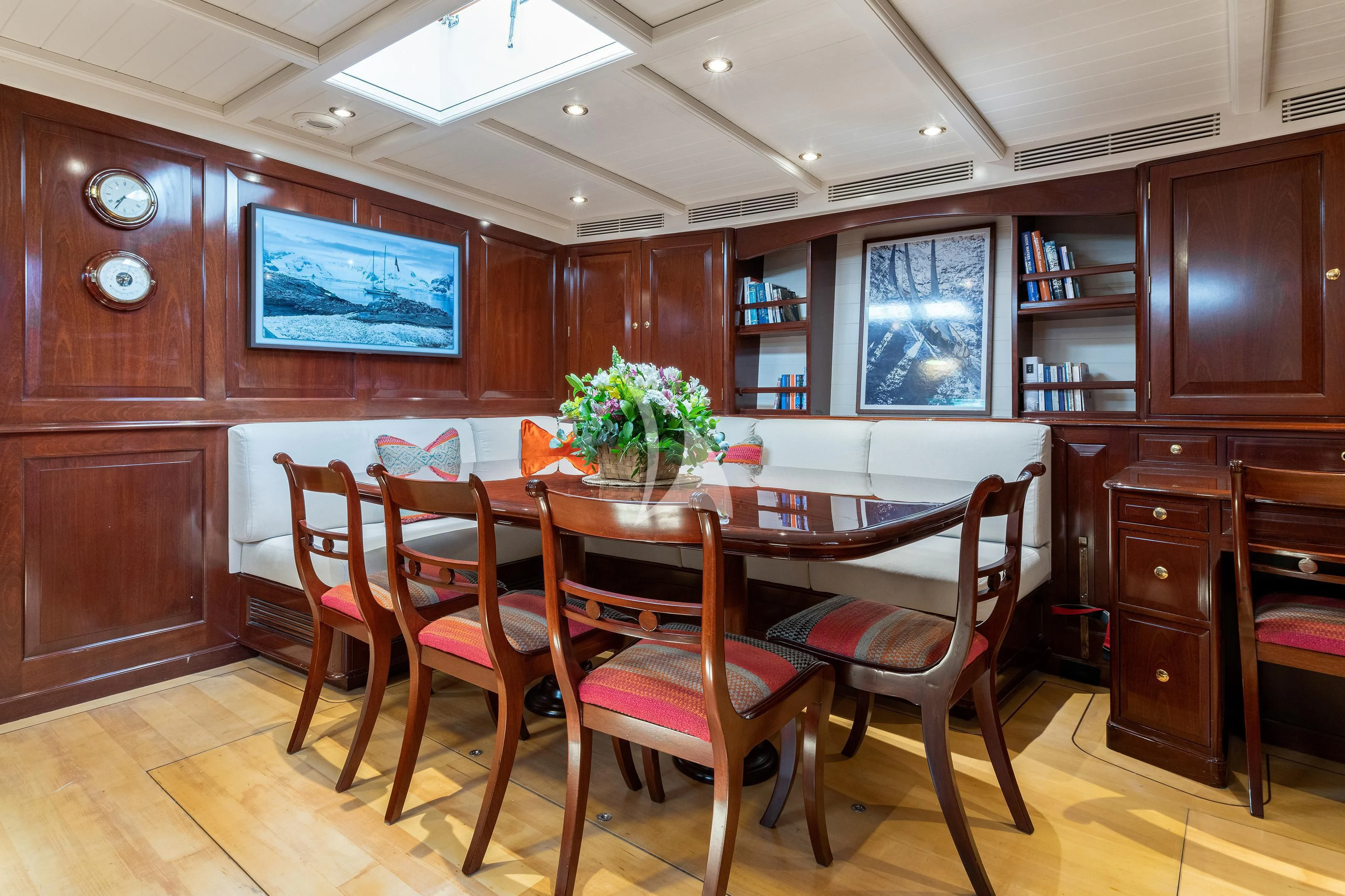 a kitchen with a table and chairs aboard WINDROSE OF AMSTERDAM Yacht for Sale