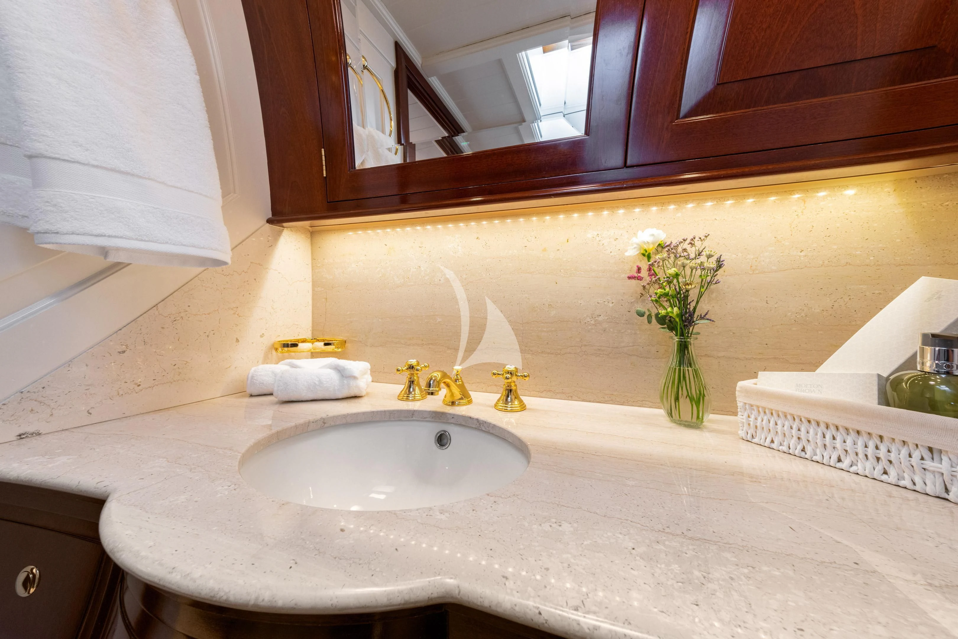 a bathroom with a sink and a mirror aboard WINDROSE OF AMSTERDAM Yacht for Sale