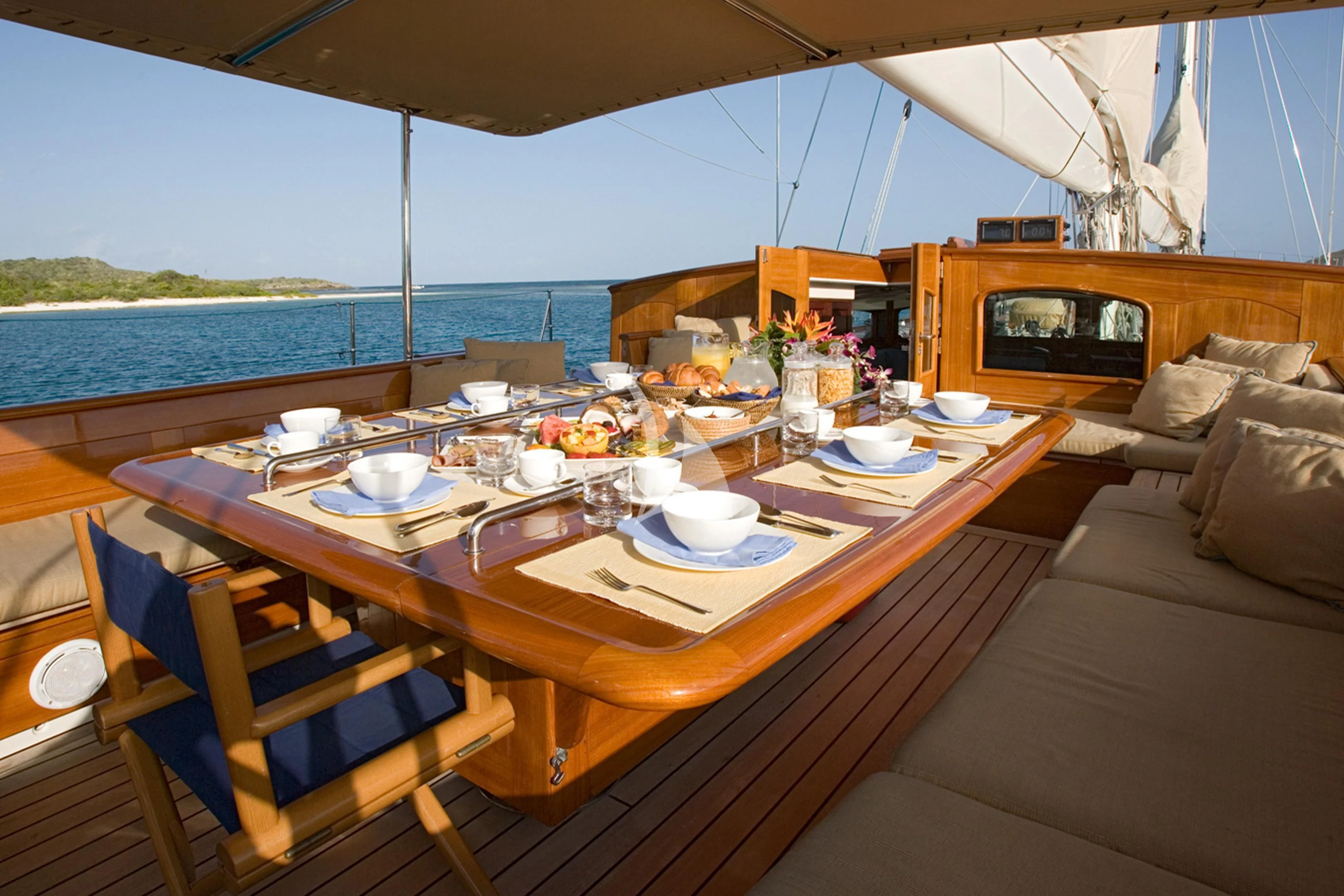a table with plates and cups on it aboard WINDROSE OF AMSTERDAM Yacht for Sale