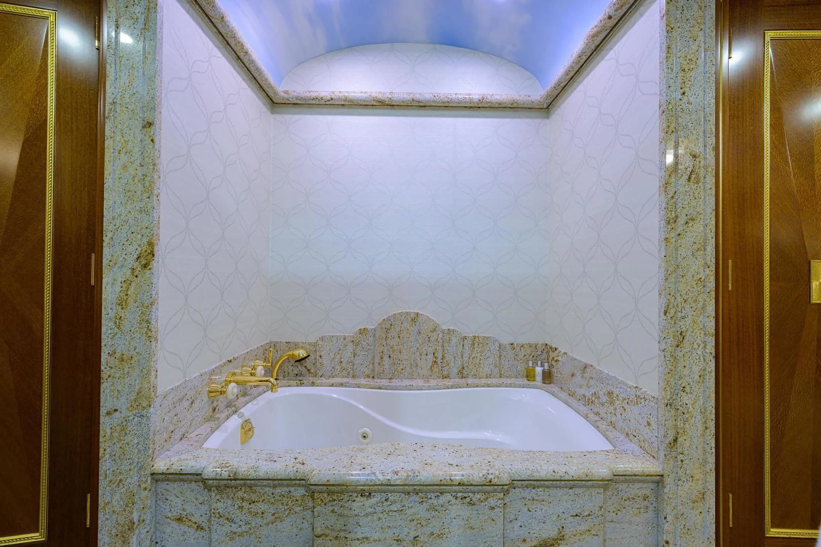 a bathtub in a bathroom aboard STARSHIP Yacht for Charter