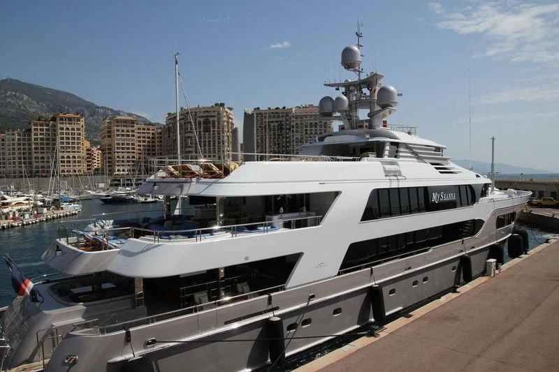 a boat docked at a pier aboard STARSHIP Yacht for Charter