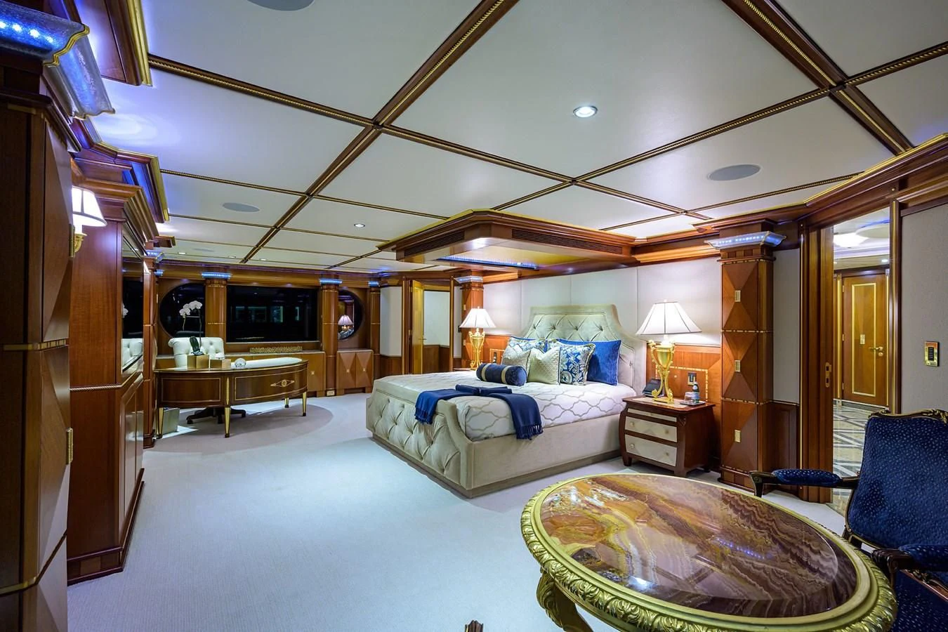 a bedroom with a large bed aboard STARSHIP Yacht for Charter