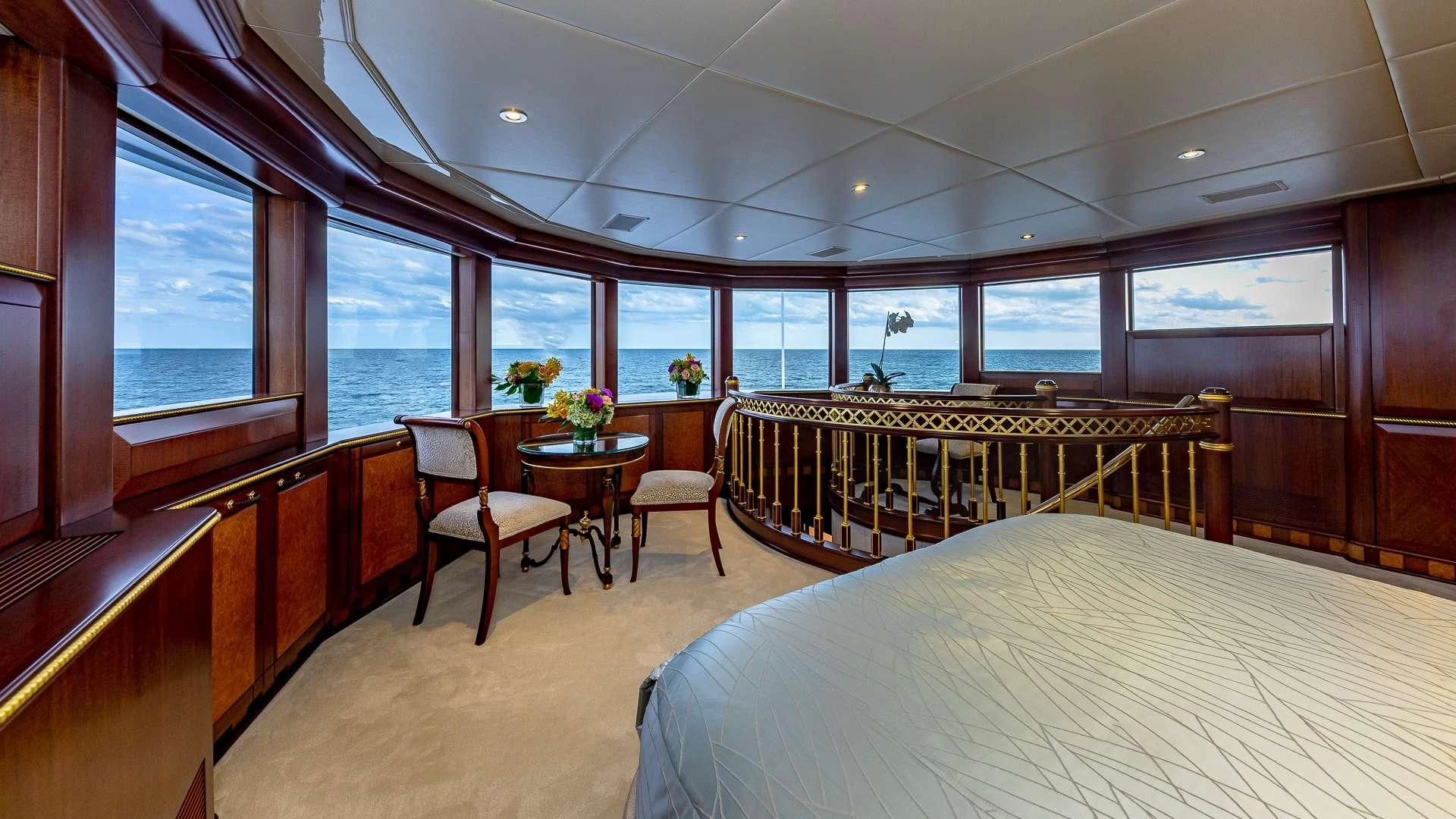 a room with a table and chairs aboard STARSHIP Yacht for Charter