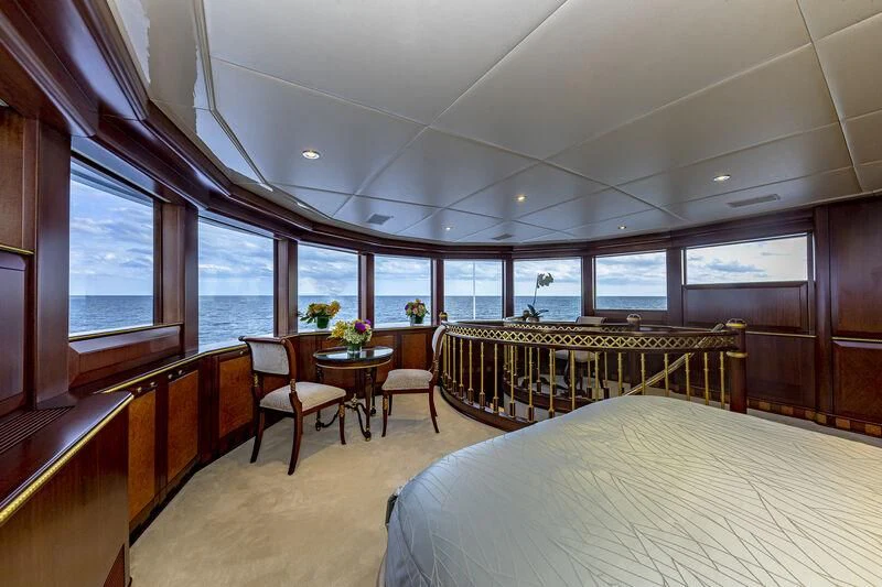 a room with a table and chairs aboard STARSHIP Yacht for Charter