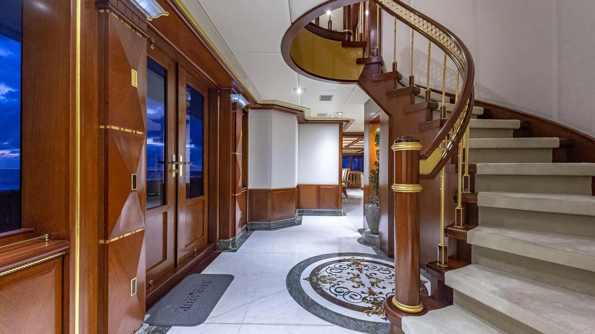 a staircase in a building aboard STARSHIP Yacht for Charter