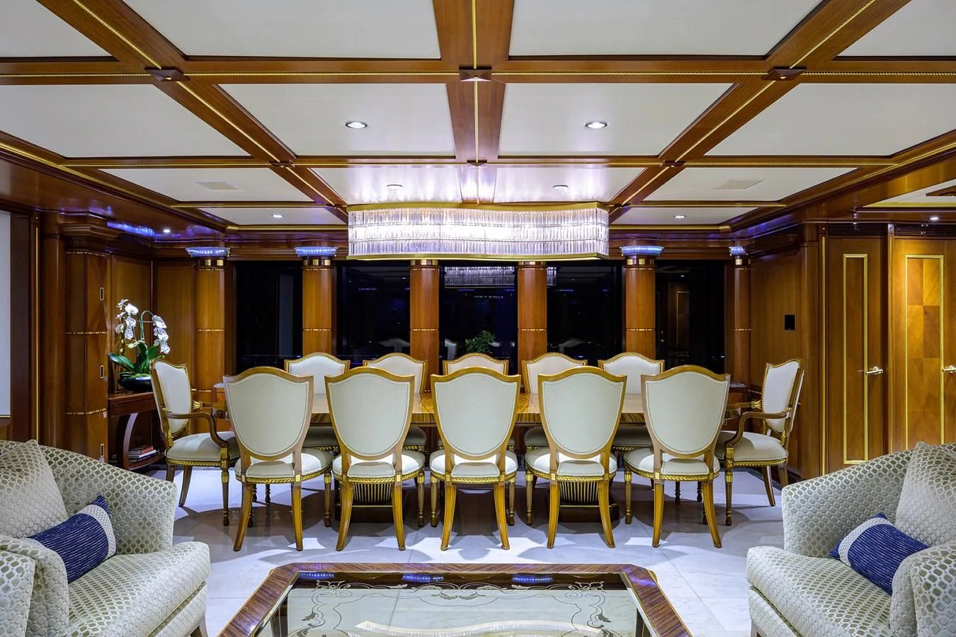 a room with chairs and tables aboard STARSHIP Yacht for Charter