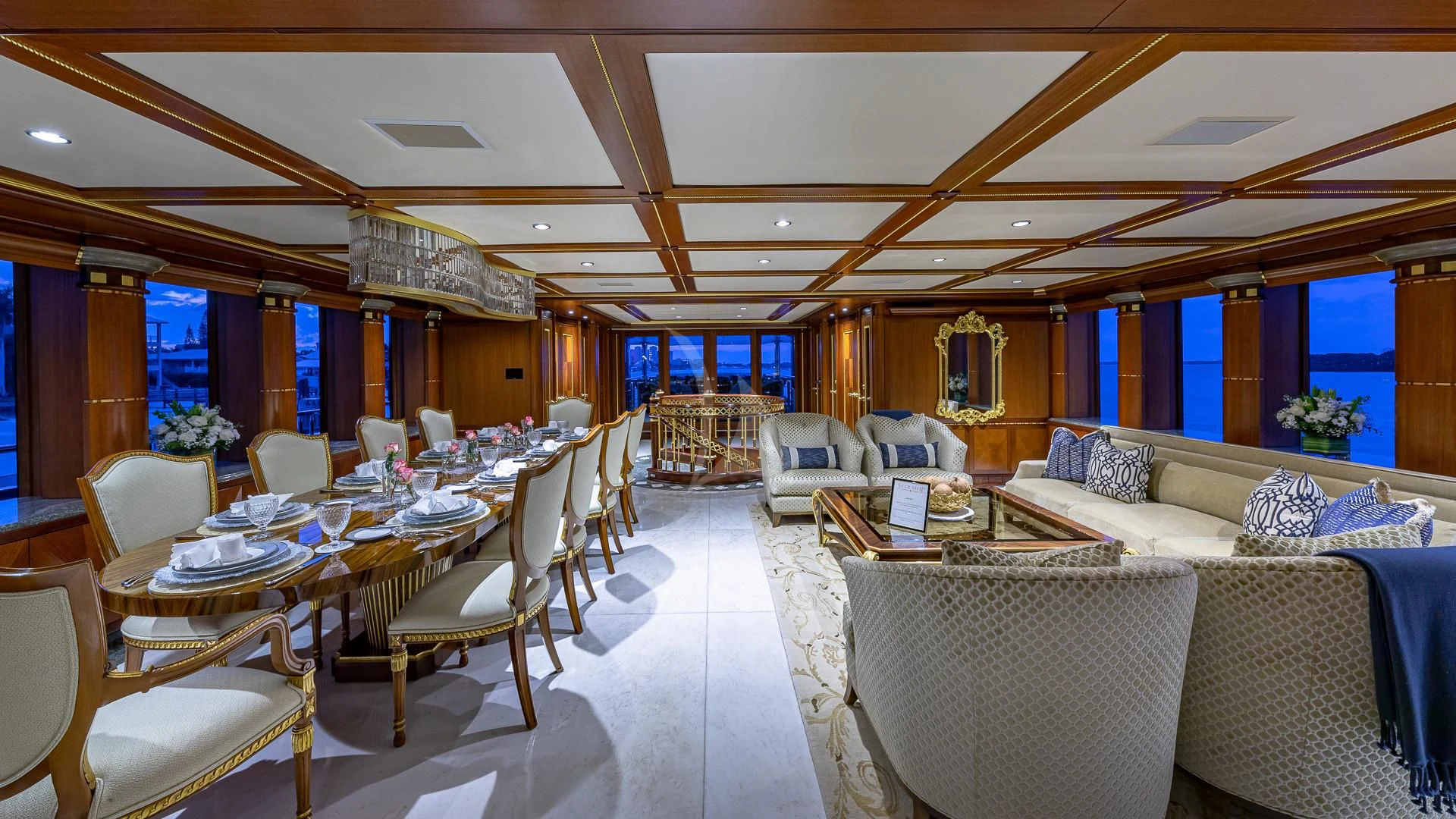 a large room with tables and chairs aboard STARSHIP Yacht for Charter