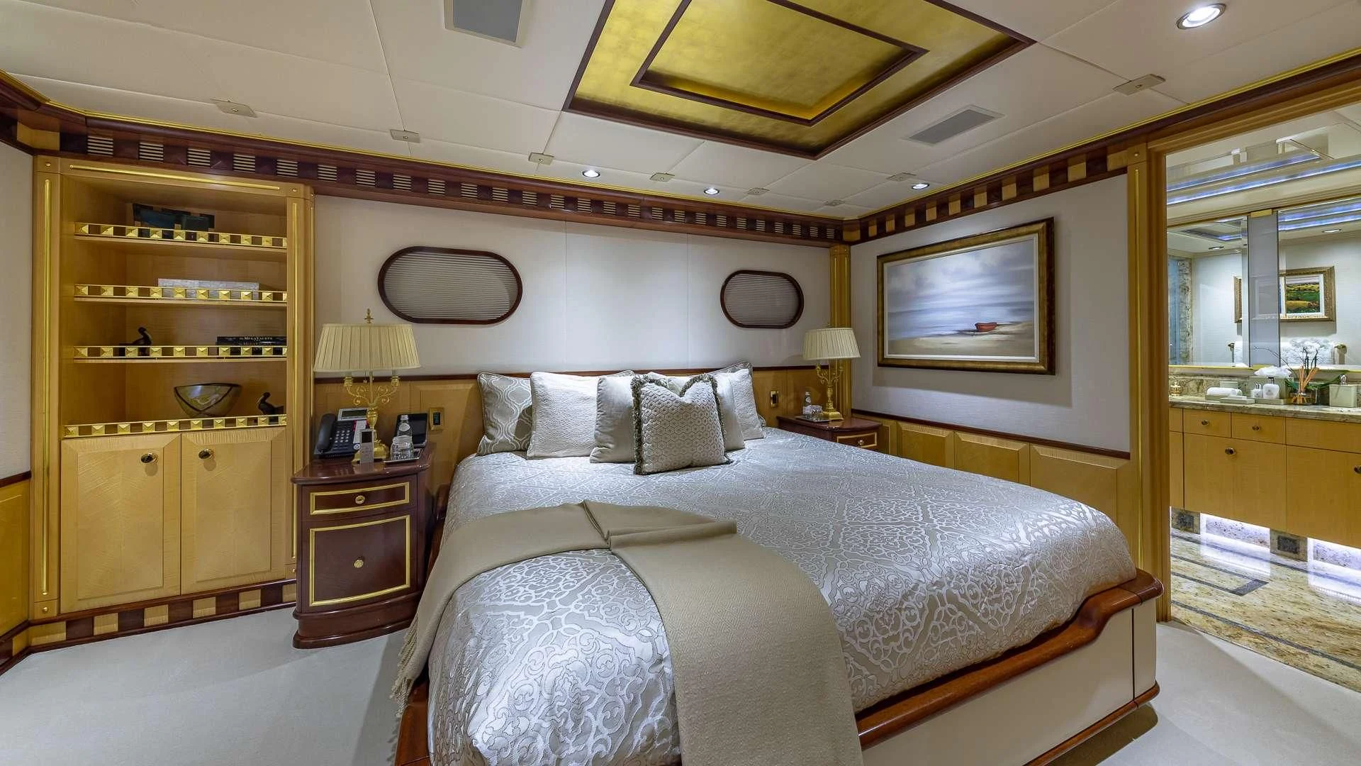 a bedroom with a large bed aboard STARSHIP Yacht for Charter