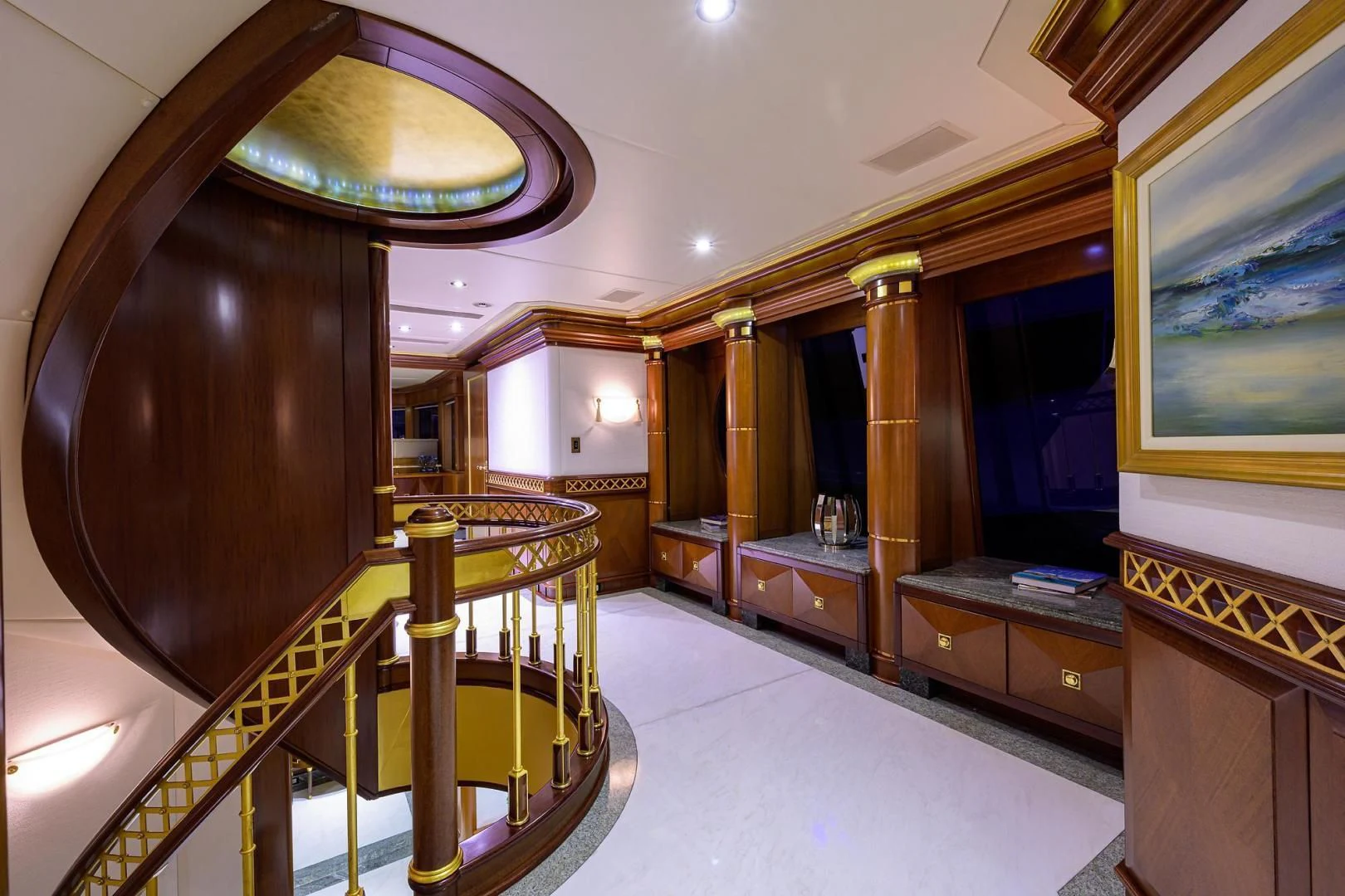 a large room with a large staircase aboard STARSHIP Yacht for Charter