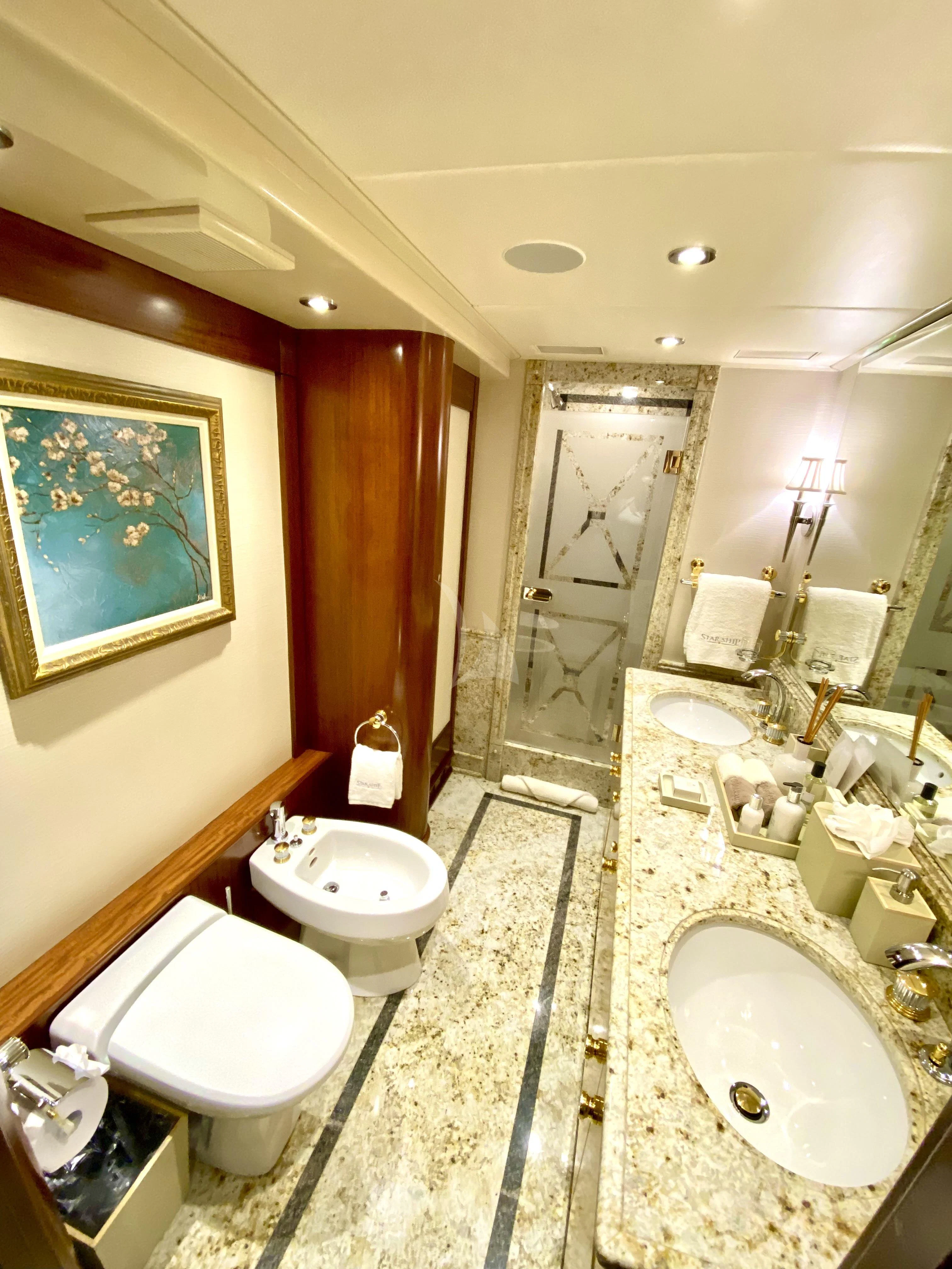a bathroom with a sink and a toilet aboard STARSHIP Yacht for Charter