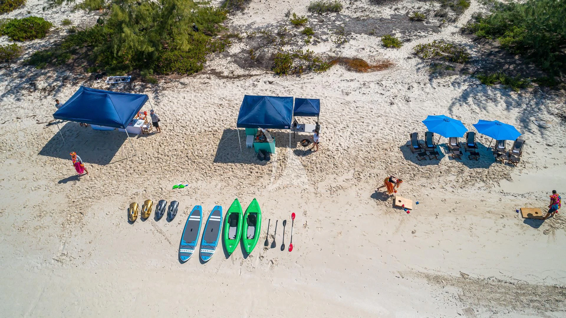 a group of chairs and umbrellas on a beach aboard STARSHIP Yacht for Charter
