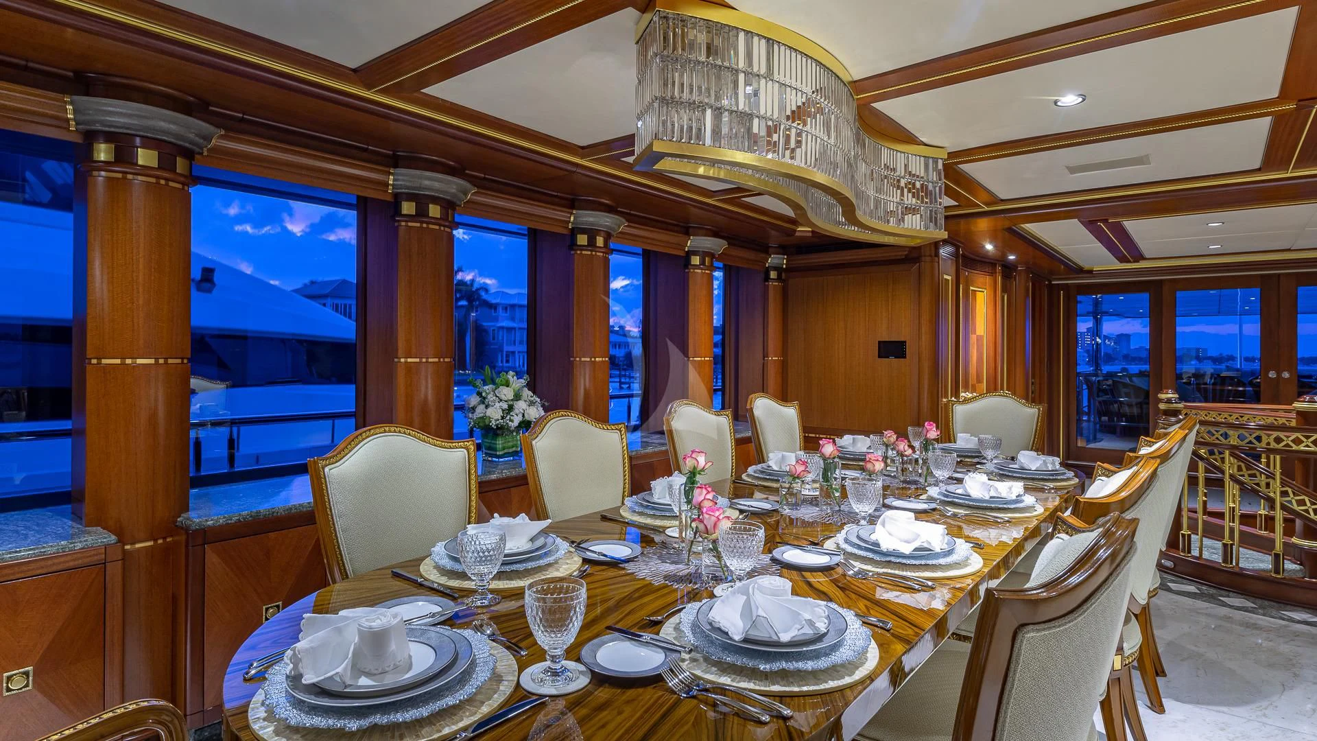 a large dining room with tables and chairs aboard STARSHIP Yacht for Charter