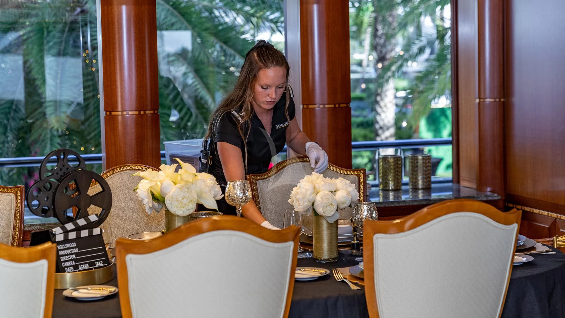 a person pouring a glass of wine aboard STARSHIP Yacht for Charter