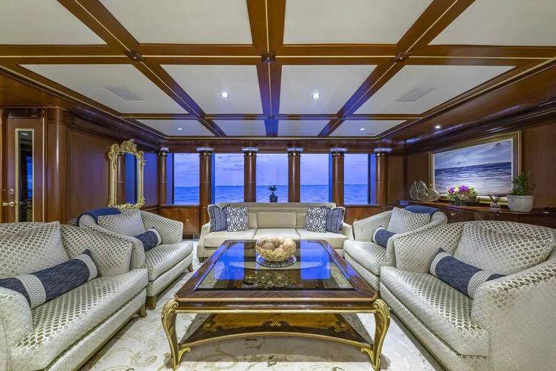 a living room with a large window aboard STARSHIP Yacht for Charter