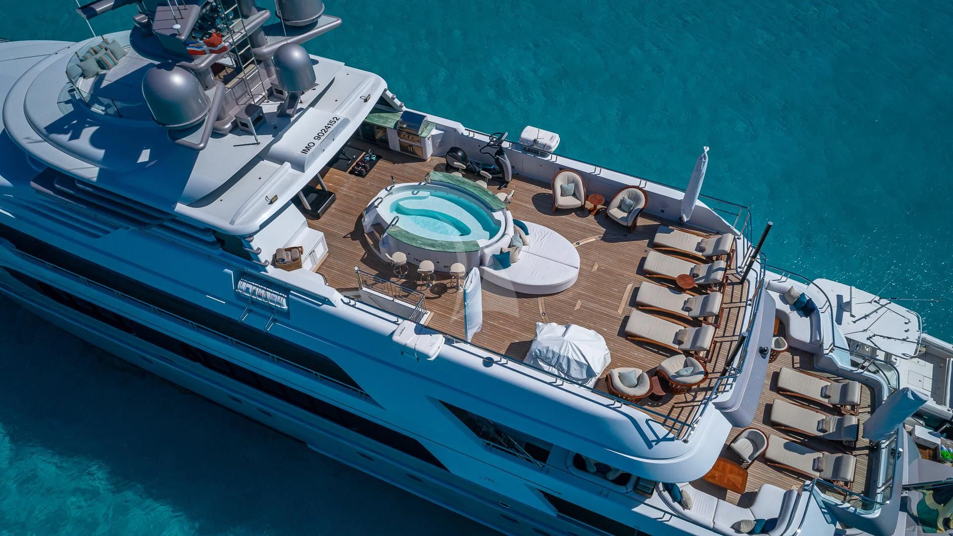 a large ship with many small satellite dishes on it aboard STARSHIP Yacht for Charter