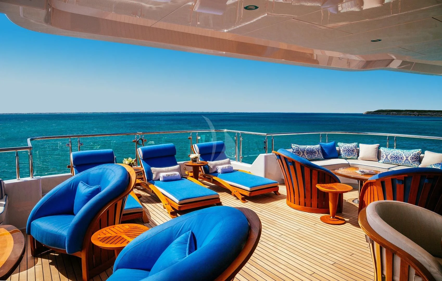 a room with chairs and tables aboard STARSHIP Yacht for Charter